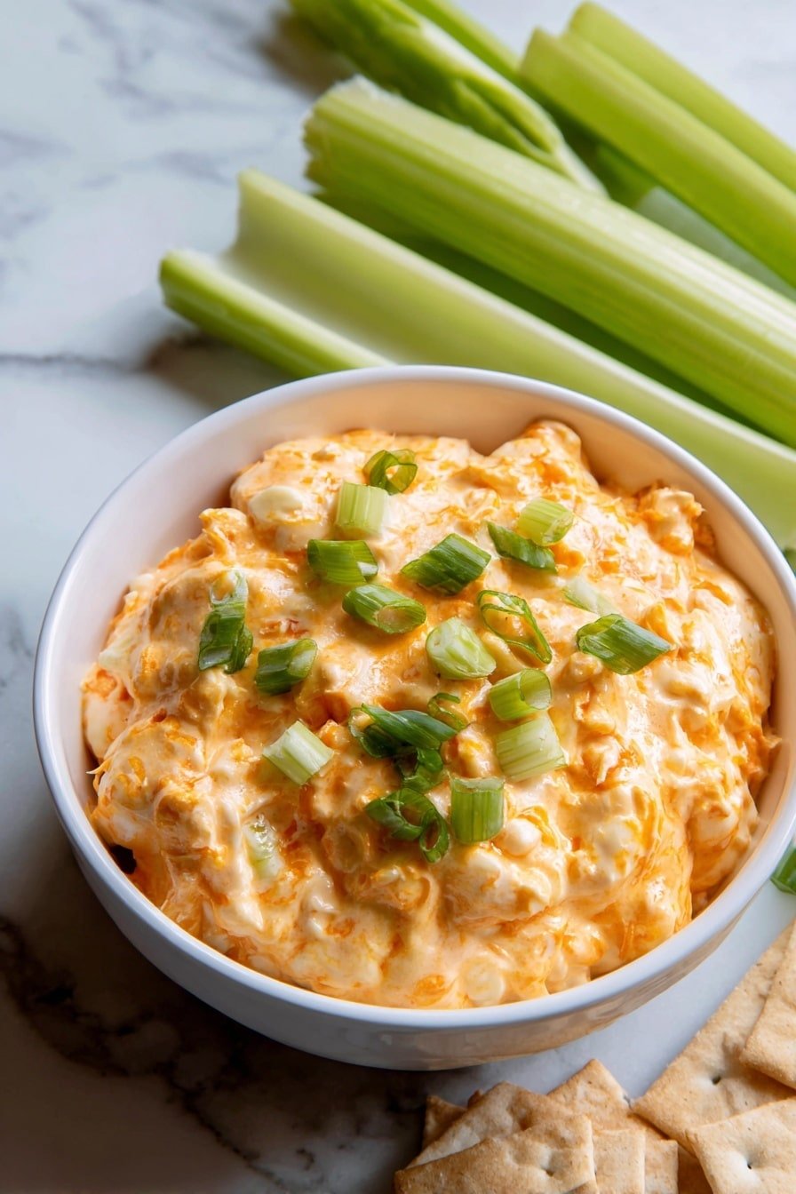 Crockpot Buffalo Chicken Dip Recipe - Article Image 2 — Crockpot Buffalo Chicken Dip, Buffalo Chicken Dip recipe, slow cooker buffalo dip, spicy buffalo chicken appetizer, cheesy buffalo chicken dip