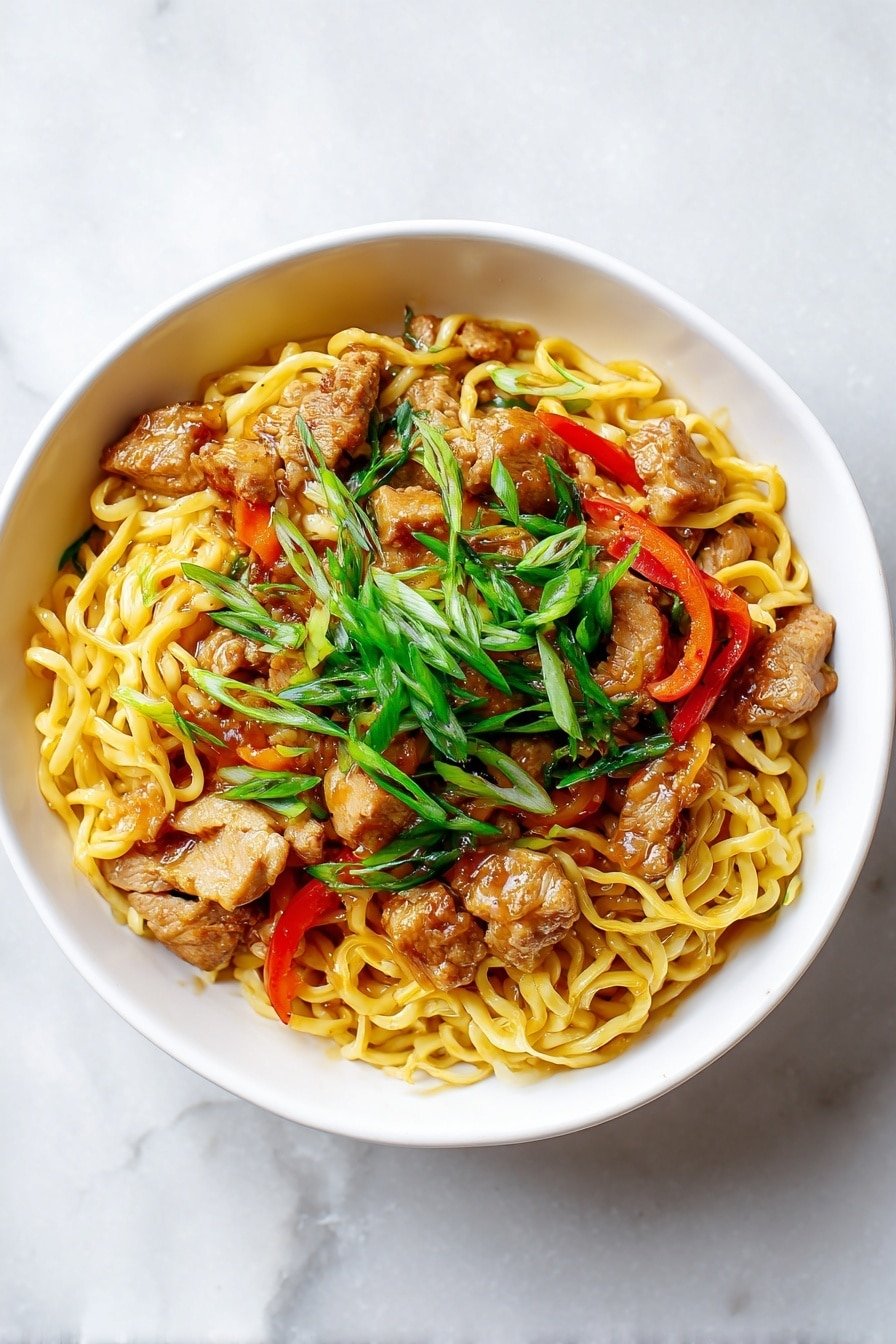 A white bowl filled with three main layers: the bottom layer is a mound of cooked yellow noodles tangled and coated with a shiny light brown sauce; the middle layer has chunks of light-colored cooked meat and thin strips of bright red bell pepper scattered throughout; the top layer is garnished with fresh green sliced scallions spread evenly on top. The bowl sits on a white marbled surface with soft natural light casting shadows. photo taken with an iphone --ar 2:3 --v 7 — Easy Chicken Lo Mein, chicken lo mein, quick Chinese noodles, Asian stir-fry recipe, homemade lo mein