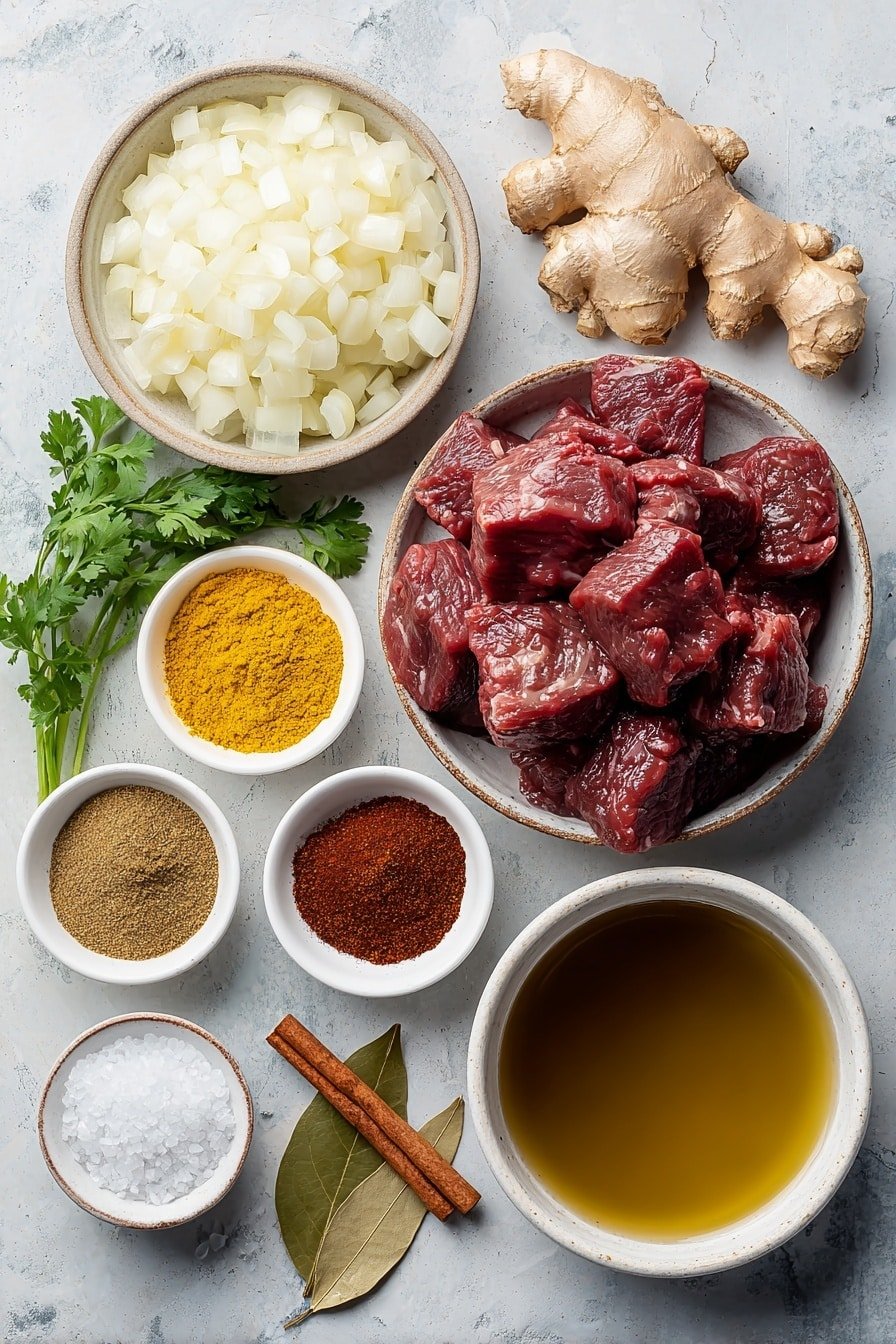Flat lay of a small white ceramic bowl of golden vegetable oil, a neatly stacked pile of thick chuck beef cubes, a small mound of finely chopped white onions, two whole peeled garlic cloves, a piece of fresh ginger root with rough light brown skin and pale interior, tiny white ceramic bowls each containing bright yellow ground turmeric, warm brown ground coriander, deep brown garam masala, earthy brown ground cumin, and vibrant red chili powder, a small white ceramic bowl filled with rich brown beef broth, a smaller white bowl of clear water, one whole cinnamon stick, a single dried brown bay leaf, a small bunch of fresh green cilantro sprigs, and a pinch of coarse salt crystals arranged symmetrically on a clean white marble surface, soft natural light, photo taken with an iPhone, professional food photography style, fresh ingredients, white ceramic bowls, no bottles, no duplicates, no utensils, no packaging --ar 2:3 --v 7 --p m7354639359234015250 — Slow Cooker Indian Beef Curry, Indian Beef Curry, Easy Indian Beef Curry, Slow Cooker Beef Recipes, Comforting Beef Curry