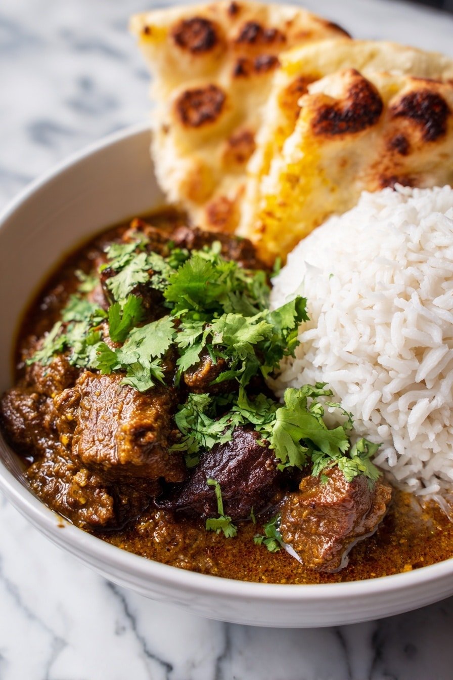 The image shows a wooden bowl filled with three layers of food. The bottom layer has white rice with a fluffy texture placed on the left side. The right side has a rich brown curry with chunks of meat covered in thick sauce, sprinkled with fresh green cilantro leaves. Behind the curry, there are two pieces of toasted flatbread with a golden-brown color and charred spots, leaning on the side. The bowl sits on a white marbled surface. photo taken with an iphone --ar 2:3 --v 7 — Slow Cooker Indian Beef Curry, Indian Beef Curry, Easy Indian Beef Curry, Slow Cooker Beef Recipes, Comforting Beef Curry