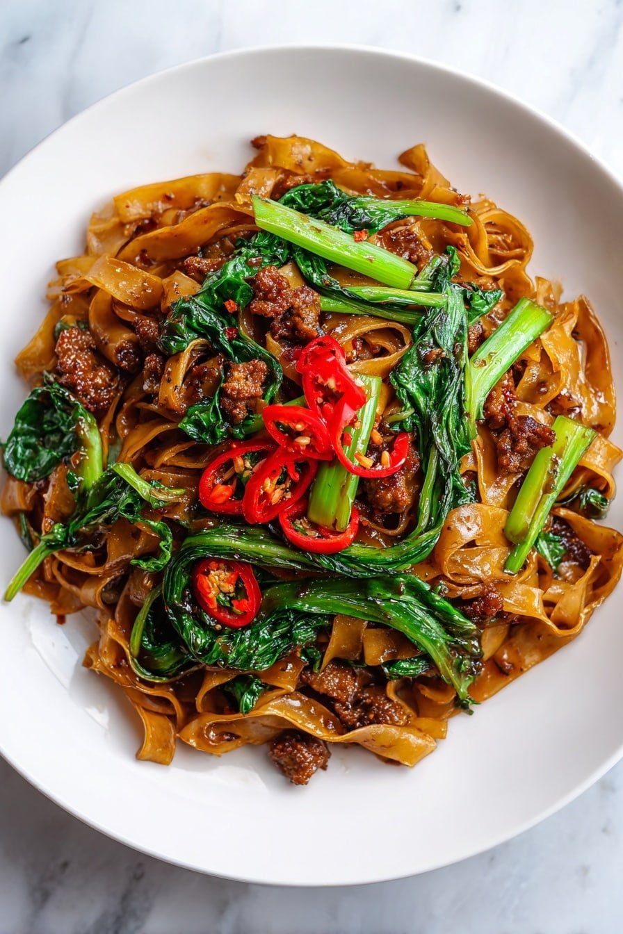 Quick Drunken Noodles Recipe - Article Image 1 — Quick Drunken Noodles, Thai stir-fry recipes, easy noodle dishes, spicy chicken and vegetable stir-fry, quick weeknight dinners
