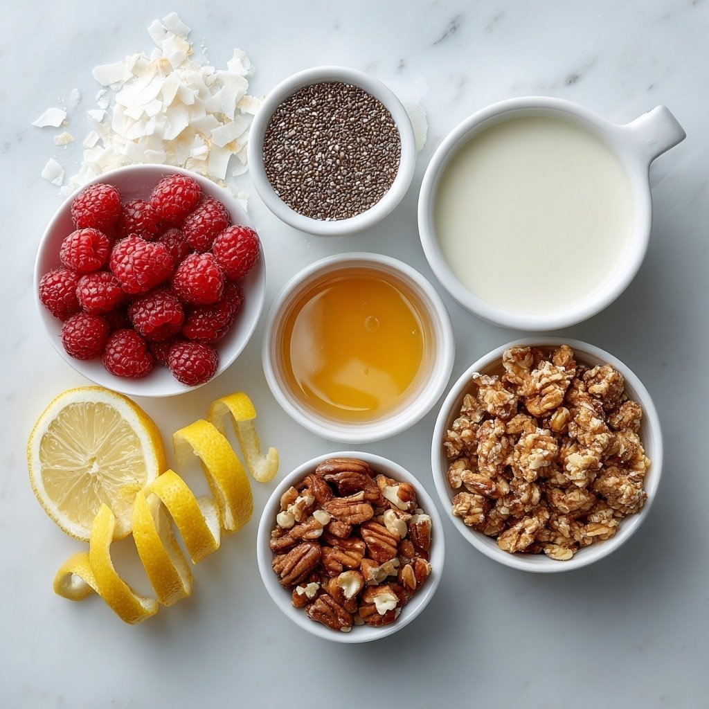 Flat lay of fresh bright red raspberries in a small pile, a small white ceramic bowl filled with shiny black chia seeds, a small white ceramic bowl holding smooth creamy almond milk, a small white ceramic bowl with golden maple syrup glistening, a few ivory coconut flakes scattered beside a small white ceramic bowl, a small white ceramic bowl with crunchy golden granola clusters, a small pile of chopped mixed nuts with warm brown and beige tones, and a fresh lemon with a thin strip of bright yellow zest carefully curled on a small white ceramic plate, all arranged in perfect symmetry and balanced proportions, placed on a clean white marble surface, soft natural light, photo taken with an iPhone, professional food photography style, fresh ingredients, white ceramic bowls, no bottles, no duplicates, no utensils, no packaging --ar 1:1 --v 7 --p m7354639359234015250 — Raspberry Chia Pudding, healthy chia pudding, easy breakfast recipes, vegan Raspberry pudding, fruit chia dessert