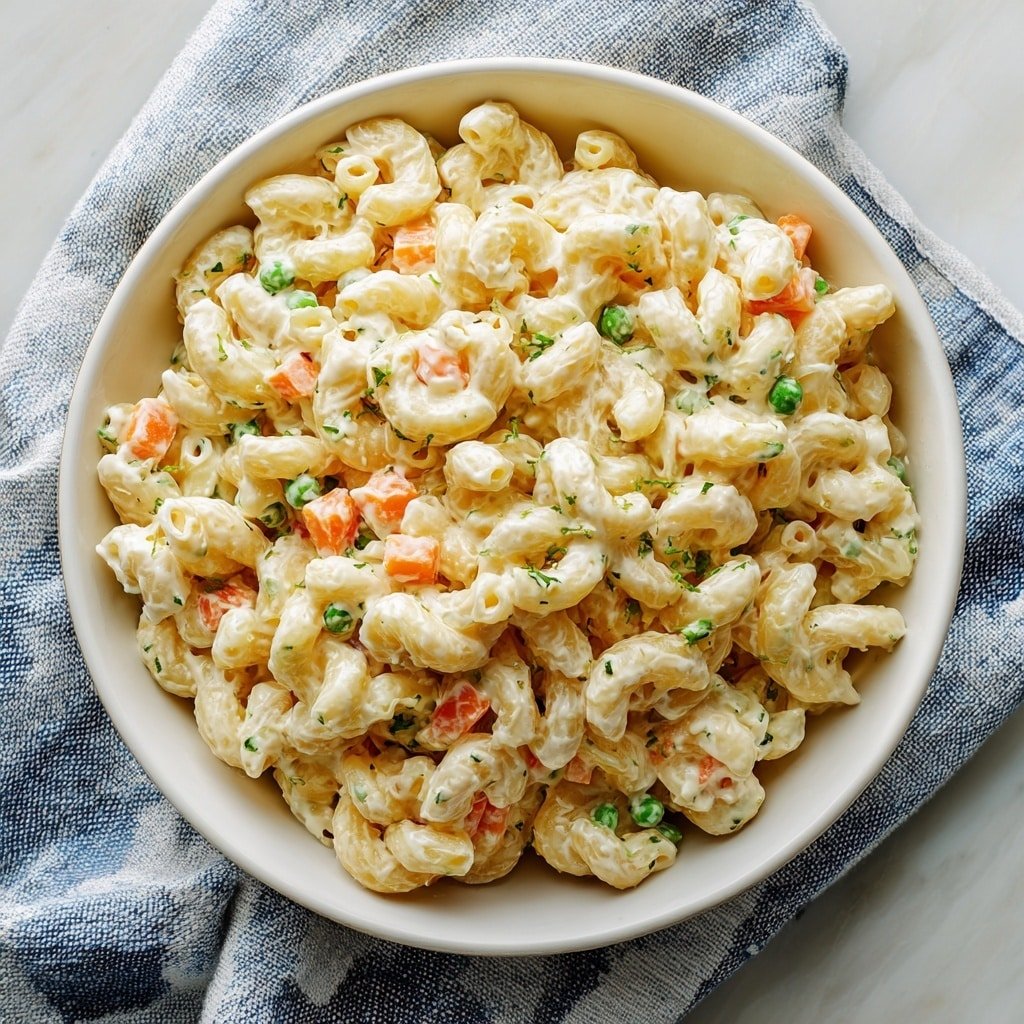 Dolly Parton’s Macaroni Salad Recipe - Article Image 1 — Dolly Parton’s Macaroni Salad, Southern macaroni salad recipe, creamy pasta salad, easy summer side dish, homemade macaroni salad