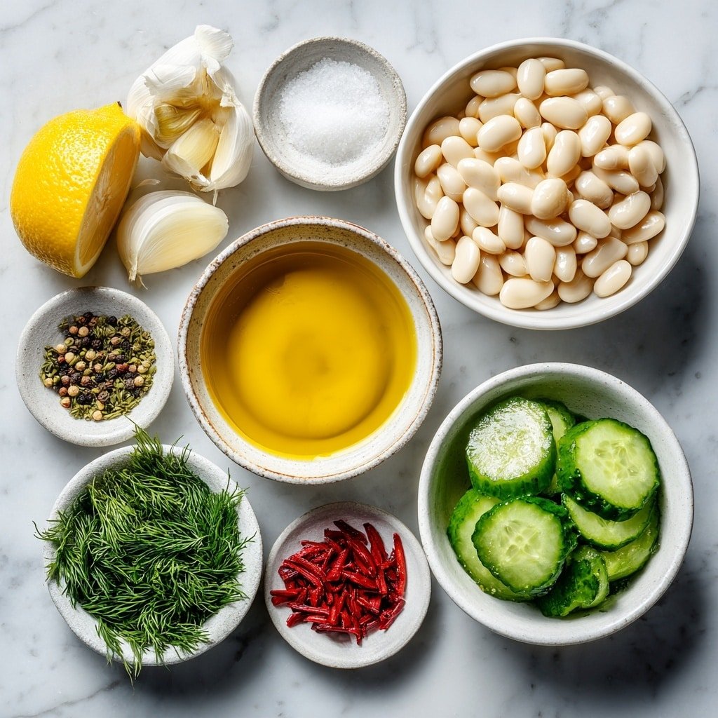 Flat lay of a whole garlic clove, a small white ceramic bowl with fresh lemon juice, a small white ceramic bowl filled with golden extra virgin olive oil, a small white ceramic bowl containing smooth Dijon mustard, a small white ceramic bowl of coarse salt, a small white ceramic bowl with black peppercorns, a white ceramic bowl of rinsed whole white beans, two fresh Persian cucumbers sliced thinly arranged neatly, a small pile of bright red radish matchsticks, a small bunch of finely chopped fresh dill, and sliced green onions showing green and white parts, all arranged in perfect symmetry on a clean white marble surface, soft natural light, photo taken with an iPhone, professional food photography style, fresh ingredients, white ceramic bowls, no bottles, no duplicates, no utensils, no packaging --ar 1:1 --v 7 --p m7354639359234015250 — Dilly White Bean Cucumber Salad, white bean cucumber salad, fresh bean salad, lemon dill salad, healthy vegetable salad