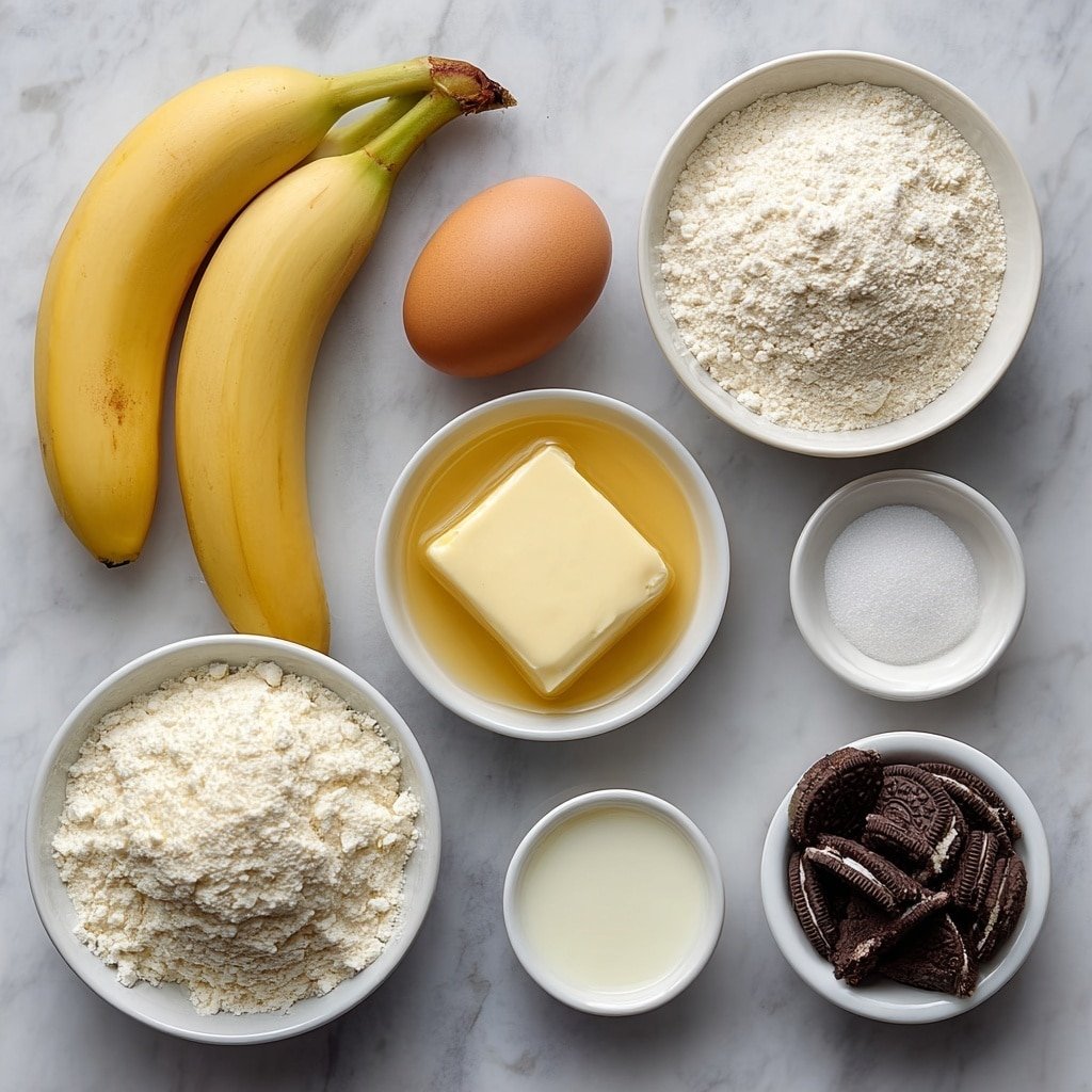 Flat lay of three ripe peeled bananas, a small white bowl of melted butter, a small white bowl of granulated sugar, one whole uncracked brown egg, a small white bowl of clear vanilla extract, a small white bowl of baking soda powder, a small white bowl of salt, a small white bowl of all-purpose flour, crushed Oreo cookie pieces scattered neatly on a simple white ceramic plate placed on a clean white marble surface, soft natural light, photo taken with an iPhone, professional food photography style, fresh ingredients, white ceramic bowls, no bottles, no duplicates, no utensils, no packaging --ar 1:1 --v 7 --p m7354639359234015250 — Oreo Banana Bread, Oreo Banana Bread Recipe, Chocolate Banana Bread, Easy Oreo Banana Bread, Best Banana Bread with Oreos